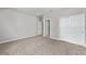 Spacious bedroom featuring carpet flooring, neutral walls and a closet with doors at 5714 Sw 75Th Ave, Ocala, FL 34474