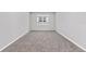 Bright bedroom with a large window and neutral walls, creating a serene atmosphere at 5714 Sw 75Th Ave, Ocala, FL 34474