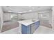 Elegant kitchen with a central island and an open layout to the spacious living room at 5714 Sw 75Th Ave, Ocala, FL 34474