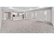 Open-concept living area with plush carpeting, ideal for entertaining and Gathering gatherings at 5714 Sw 75Th Ave, Ocala, FL 34474