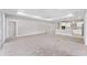 Expansive living room featuring tray ceiling and neutral color scheme, perfect for modern living at 5714 Sw 75Th Ave, Ocala, FL 34474