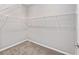 Walk-in closet offering ample storage with wire shelving and neutral carpeting at 5714 Sw 75Th Ave, Ocala, FL 34474