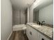 This bathroom features a bathtub, tiled shower, and a granite-topped vanity with ample storage at 5799 Sw 207Th Ct, Dunnellon, FL 34431