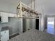 Granite countertops and modern light fixtures add elegance to this kitchen at 5799 Sw 207Th Ct, Dunnellon, FL 34431
