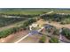 Expansive aerial view of a charming home with a circular driveway and lush, green surroundings at 5819 Ne 72Nd St, Silver Springs, FL 34488