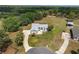 A beautiful home with a circular driveway and mature landscaping is captured from above at 5819 Ne 72Nd St, Silver Springs, FL 34488