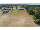 Overhead view of a lovely property with a home, an in-ground pool, and surrounding yard at 5819 Ne 72Nd St, Silver Springs, FL 34488