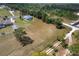 Expansive property featuring a home with a pool, surrounded by mature trees and fenced pasture land at 5819 Ne 72Nd St, Silver Springs, FL 34488