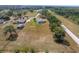 Spacious yard surrounding a home that features an in-ground pool and separate detached structure at 5819 Ne 72Nd St, Silver Springs, FL 34488