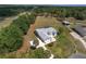Picturesque aerial view showcases a home with a large yard and lush trees at 5819 Ne 72Nd St, Silver Springs, FL 34488
