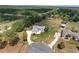 A bird's eye view features a home, an in-ground pool, and a spacious yard with mature trees at 5819 Ne 72Nd St, Silver Springs, FL 34488