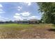 The spacious backyard features a screen enclosed porch and plenty of green space, creating a private and relaxing outdoor retreat at 5819 Ne 72Nd St, Silver Springs, FL 34488