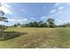 A sprawling backyard features mature trees, fencing, and plenty of green space, creating a private oasis for outdoor enjoyment at 5819 Ne 72Nd St, Silver Springs, FL 34488