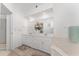 Bright bathroom features a double sink vanity, soaking tub, and a full mirror at 5819 Ne 72Nd St, Silver Springs, FL 34488