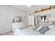 Bedroom features a queen bed, bright gray walls, and carpet flooring at 5819 Ne 72Nd St, Silver Springs, FL 34488