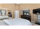 Bedroom featuring a large mirror, a TV and neutral colors at 5819 Ne 72Nd St, Silver Springs, FL 34488