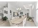 Open concept living with dining room, piano, living room, and sliding glass doors to patio at 5819 Ne 72Nd St, Silver Springs, FL 34488