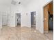 Hallway with decorative tile flooring leading to bedrooms and bathrooms in a home's open layout at 5819 Ne 72Nd St, Silver Springs, FL 34488