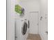 Clean laundry room with modern washer and dryer, ample storage, and convenient access to household essentials at 5819 Ne 72Nd St, Silver Springs, FL 34488