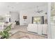 Spacious living room featuring high ceilings, modern fan, and sliding glass doors to the outdoor area at 5819 Ne 72Nd St, Silver Springs, FL 34488