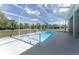 Screened-in pool with serene backyard views and clear water at 5819 Ne 72Nd St, Silver Springs, FL 34488