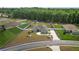 Aerial shot of the property, highlighting its spacious lot, the house exterior, and its proximity to neighboring homes at 6292 Se 13Th St, Ocala, FL 34472