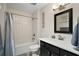 Bathroom featuring a subway tile shower and vanity with storage at 6292 Se 13Th St, Ocala, FL 34472