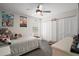 Cozy bedroom with a ceiling fan, closet, and neutral décor at 6292 Se 13Th St, Ocala, FL 34472