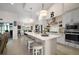 Open-concept kitchen featuring a spacious island with seating and modern appliances at 6292 Se 13Th St, Ocala, FL 34472