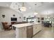 Bright and airy kitchen island featuring pendant lighting and stainless steel appliances at 6292 Se 13Th St, Ocala, FL 34472