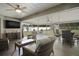 Inviting covered patio with comfortable seating, ceiling fans, and an outdoor TV at 6292 Se 13Th St, Ocala, FL 34472