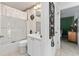 Bathroom featuring a shower and bathtub combination, white vanity, and tile floor at 680 Farmington Ave, The Villages, FL 32162