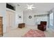 Bedroom with large walk in and neutral colored carpet at 680 Farmington Ave, The Villages, FL 32162