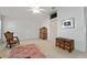 Spacious bedroom with vaulted ceiling, ceiling fan and lots of natural light at 680 Farmington Ave, The Villages, FL 32162