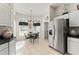 Eat-in kitchen with stainless refrigerator and lots of natural light at 680 Farmington Ave, The Villages, FL 32162