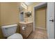 A well-lit bathroom featuring a pedestal sink, updated lighting, and neutral tile flooring at 7370 Sw 129Th Ln, Ocala, FL 34473
