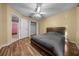 A cozy bedroom with hardwood floors and closet space at 7370 Sw 129Th Ln, Ocala, FL 34473