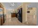 The open concept kitchen features stainless steel appliances and a view into the living space at 7370 Sw 129Th Ln, Ocala, FL 34473