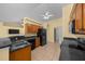 A contemporary kitchen with stainless steel appliances, a double sink, and wooden cabinets at 7370 Sw 129Th Ln, Ocala, FL 34473