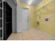 A practical laundry room with shelving, hookups, and ample space for chores at 7370 Sw 129Th Ln, Ocala, FL 34473