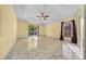 Large primary bedroom featuring tile floors, natural light, and a ceiling fan at 7370 Sw 129Th Ln, Ocala, FL 34473