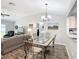 Open concept living space with dining area and views into kitchen and living room at 7474 Se 172Nd Fieldcrest St, The Villages, FL 32162