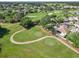 Aerial shot of winding golf cart paths through a vibrant and well-maintained golf course at 7474 Se 172Nd Fieldcrest St, The Villages, FL 32162