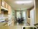 Bright eat-in kitchen with a quaint dining area and white appliances at 7474 Se 172Nd Fieldcrest St, The Villages, FL 32162