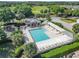 Aerial view of a community pool with shade and ample seating area at 7474 Se 172Nd Fieldcrest St, The Villages, FL 32162