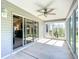 Enclosed lanai features many windows for natural light with sliding doors to the living area at 7474 Se 172Nd Fieldcrest St, The Villages, FL 32162