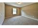 Cozy bedroom with neutral carpeting, a window providing natural light, and a closet at 861 Sw Fig Tree Ln, Dunnellon, FL 34431