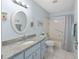 Bathroom with a tub, shower, modern fixtures and a large vanity with ample countertop space at 9069 Sw 96Th Ln # B, Ocala, FL 34481