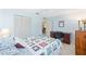Bedroom with ceiling fan and a closet view offers lots of space for dressers and storage at 9069 Sw 96Th Ln # B, Ocala, FL 34481
