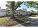 Well maintained single-story home features an attached two-car garage, cozy front porch, and a lush front lawn at 9069 Sw 96Th Ln # B, Ocala, FL 34481